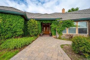 a house with a brick walkway in front of it at El Tranquillo in Templeton