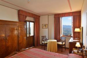 Postel nebo postele na pokoji v ubytování Hotel Fonte Cesia + 37 fotografií