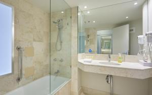 a bathroom with a shower and a sink at Private Hotel Rooms in Central Surfers in Gold Coast +23 photos