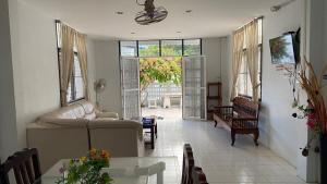 a living room with a couch and a table at Kiang Beach Villa Cha-am in Cha Am