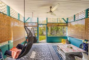 a room with a hammock and a table at Waterfront Studio Just minutes to Naples Beaches in Naples