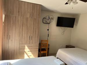 Postel nebo postele na pokoji v ubytování Hospedaje bolognesi
