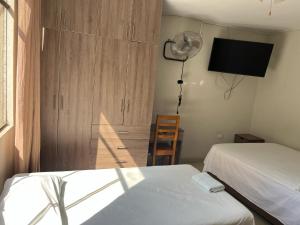 Postel nebo postele na pokoji v ubytování Hospedaje bolognesi