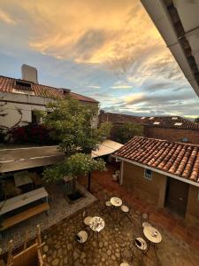 an overhead view of a patio with tables and a building at Encanto Azul in Villa de Leyva +50 photos