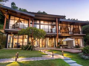 a large house with a lot of windows at Montem Villa - Venuestay in Lương Sơn