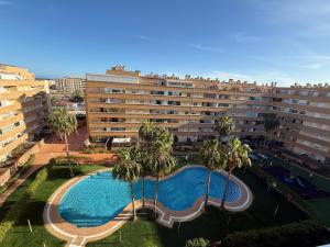 an overhead view of a large apartment building with a swimming pool at Ático Roquetas in Roquetas de Mar