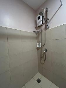 a shower in a bathroom with a shower at 14F Deluxe Unit at Sunvida Tower across SM CITY in Cebu City