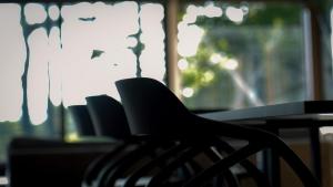 a black chair sitting in front of a table at 1980 fuji yamanakako in Yamanakako