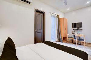 Postel nebo postele na pokoji v ubytování Super Hotel O Britania Chowk