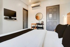 Postel nebo postele na pokoji v ubytování Super Hotel O Britania Chowk