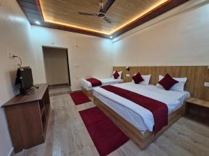 Postel nebo postele na pokoji v ubytování Hotel Aashirwad