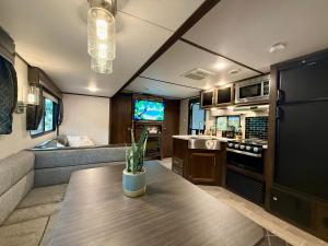 a kitchen and living room in a rv at Exclusive Glamping Resort Puerto Vallarta in Puerto Vallarta