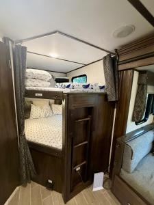 an interior of an rv with two bunk beds at Exclusive Glamping Resort Puerto Vallarta in Puerto Vallarta
