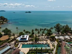 an aerial view of a resort with a pool and the ocean at Vignette Collection Dinso Resort & Villas Ko Chang by IHG in Ko Chang