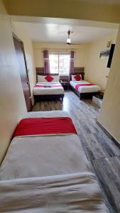 Letto o letti in una camera di Hotel Elite Pokhara