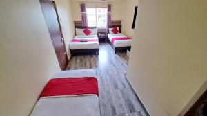 Letto o letti in una camera di Hotel Elite Pokhara