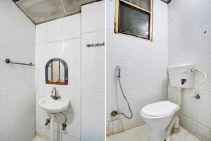 a bathroom with a toilet and a sink at HOTEL MANGALAM LUXUARY INN Near Railway station - A LUXUARY HOTEL in Lucknow