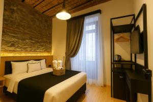 a hotel room with a bed and a window at Taksim Istiklal Street Kamilbey Hotel in Istanbul +16 photos