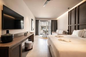 Voodi või voodid majutusasutuse Mosay All Suite Hotel toas