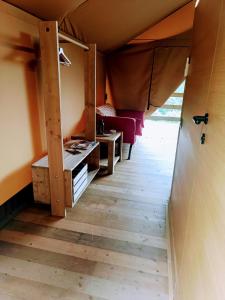 Postel nebo postele na pokoji v ubytování Glamping Podere Poggiagrilli
