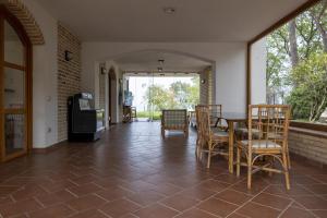 a dining room with a table and chairs and a window at Villa Bonaccia - YourPlace Abruzzo in Ortona