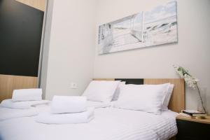 a bedroom with two white pillows on a bed at POOL RESORT- Vila Lena- Apartman 2 in Vrdnik +35 photos