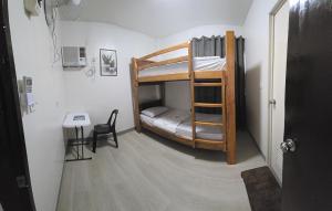 Postel nebo postele na pokoji v ubytování Jam Residences