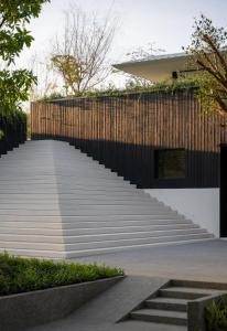 a staircase leading up to a house at Tree O'clock Pool Villa - Phuket in Thalang
