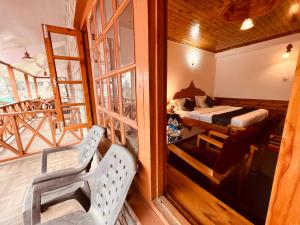 Postelja oz. postelje v sobi nastanitve Sita Hotel & Cottage, Manali - A Boutique Wellness Hotel