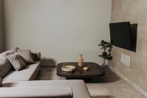 a living room with a couch and a table at Relax Villa in Marmari