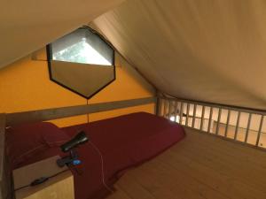 Postel nebo postele na pokoji v ubytování Glamping Podere Poggiagrilli