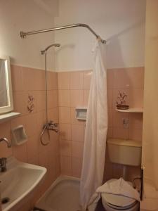 a bathroom with a tub and a toilet and a sink at Elli Marina Studios & Apts Benitses Mare in Benitses +71 photos