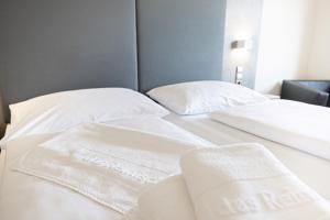 Postel nebo postele na pokoji v ubytování Das Reinisch Just Rooms