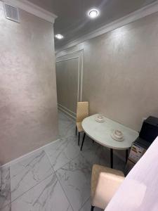 Χώρος καθιστικού στο Уютные апартаменты на площади Аль-Фараби-SHYMKENT PLAZA