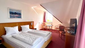 Voodi või voodid majutusasutuse Hotel Siebeneichen toas