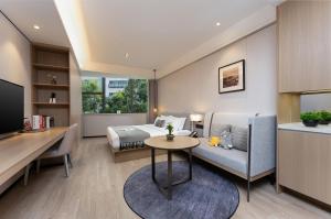 Кът за сядане в CM Serviced Apartment Shenzhen Dongmen