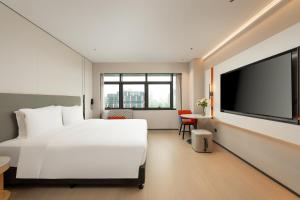 TV a/nebo společenská místnost v ubytování Holiday Inn Express Kunshan Yushan by IHG