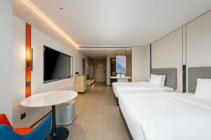 Postel nebo postele na pokoji v ubytování Holiday Inn Express Kunshan Yushan by IHG