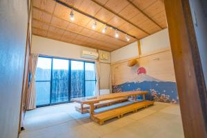 Postel nebo postele na pokoji v ubytování 箱根 竹野亭