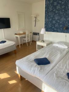 Letto o letti in una camera di Pensionat bryggan