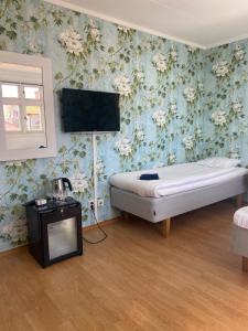 Letto o letti in una camera di Pensionat bryggan