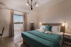 Postel nebo postele na pokoji v ubytování St Nicholas Tsilivi Apts by "elite" + 37 fotografií