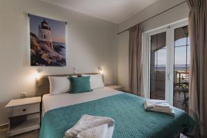 Postel nebo postele na pokoji v ubytování St Nicholas Tsilivi Apts by "elite"