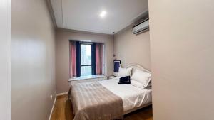 Voodi või voodid majutusasutuse Duowei Executive Apartment Changsha Branch Wuyi Square Branch toas