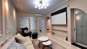 Televiisor ja/või meelelahutuskeskus majutusasutuses Duowei Executive Apartment Changsha Branch Wuyi Square Branch