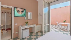 a bathroom with a sink and a mirror at Hotel Happy in Marina di Pietrasanta +114 photos