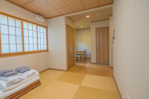 Vuode tai vuoteita majoituspaikassa 箱根仙石原心温まる雅宿