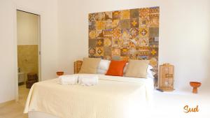 Postel nebo postele na pokoji v ubytování Le Dimore - Charme Rooms