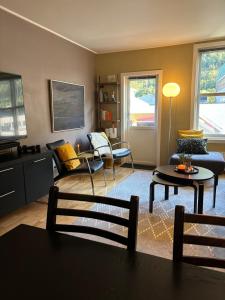 a living room with a couch and a table at Leilighet Rjukan sentrum in Rjukan