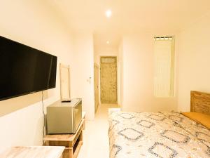 TV a/nebo společenská místnost v ubytování Alita Hotel Sanur